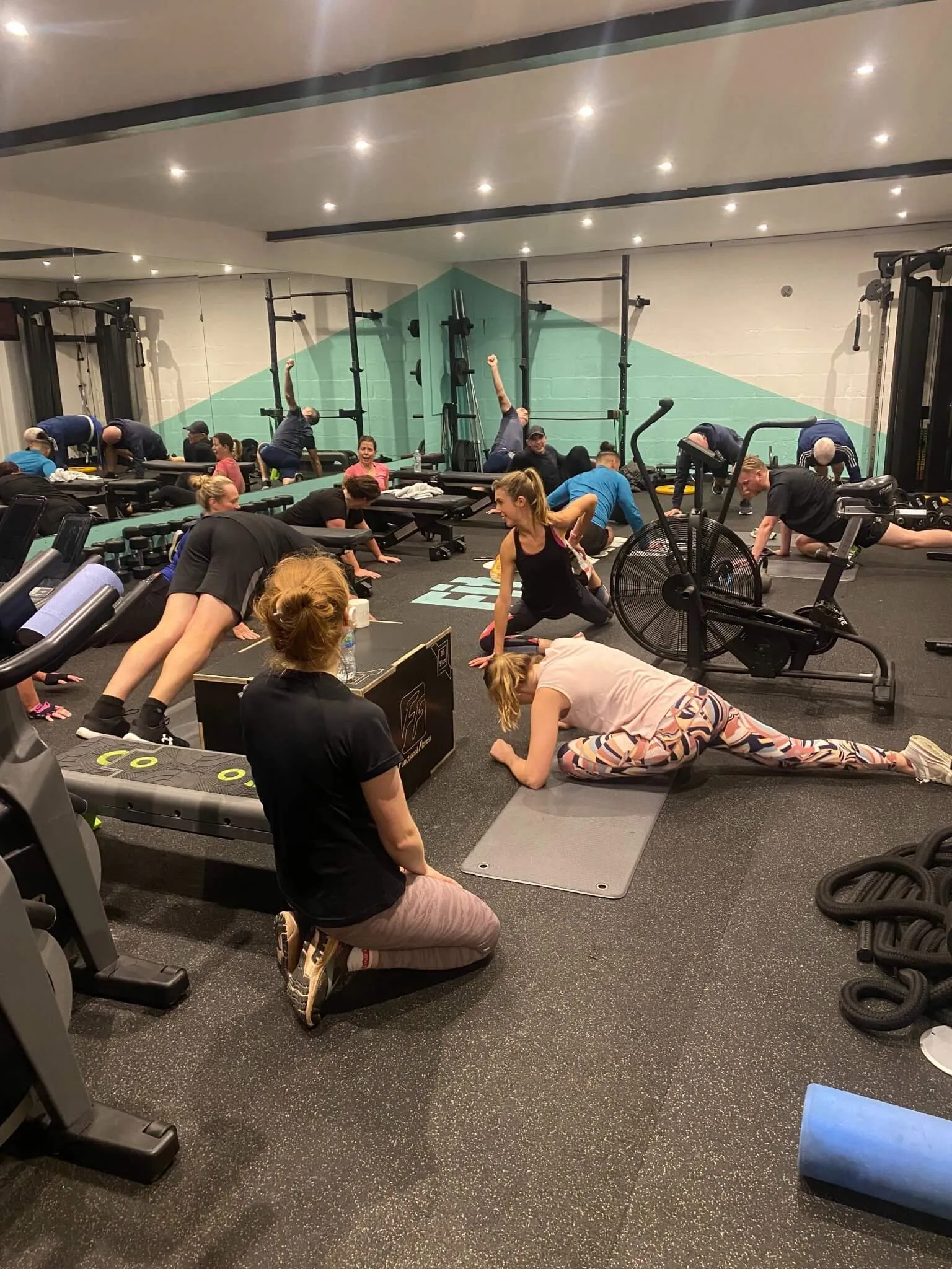 People exercising together in a modern gym environment